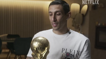 Angel di Maria screenshot 3: Angel di Maria wears a white shirt and holds trophy. 