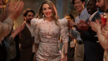 Apple Cider Vinegar TV show screenshot 2: Belle is seen in glamorous designer clothing, entering an upscale event with guests applauding her.