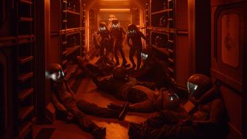 The Ark TV show screenshot 3: bodies in spacesuits lay about in the glow of orange light