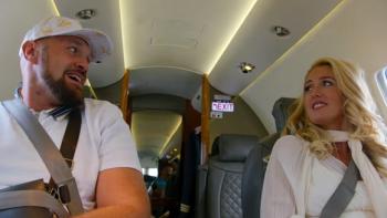 At Home with the Furys TV show screenshot: Tyson Fury and his wife, Paris, look at each other while sitting on a private airplane.
