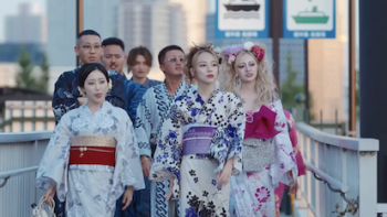 Badly in Love TV show screenshot 1: Female cast members in kimono walk ahead of male cast members. 