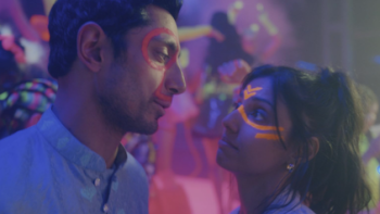 Bait TV show screenshot 3: Shah Latif and Yasmine look at eachother covered in paint.