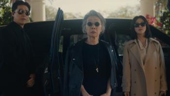 Beef Season 2 screenshot 3: Chairwoman Park exits her limousine in dark glasses and black clothing; Eunice and Dr. Kim are on either side of her