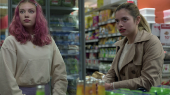 Billionaire Island screenshot 3: A girl with pink hair and girl in tan jacket in supermarket.