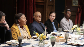 Black and Jewish America TV show screenshot 1: Henry Louis Gates, Jr. sits with men and women at a Passover seder table. 