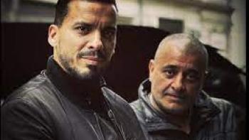 Blood Coast TV show screenshot #1: two men look grim