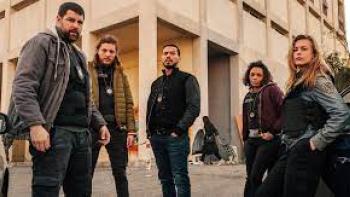 Blood Coast TV show screenshot #2: a group of people look grim