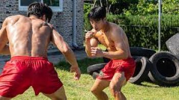 Bloodhounds TV show screenshot #1: Two young shirtless men fight