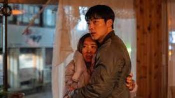 Bloodhounds TV show screenshot #3: a young man and woman hug, looking scared