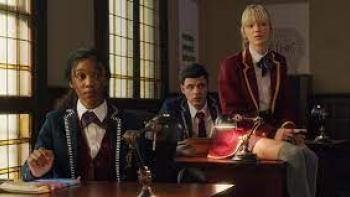 Blood & Water screenshot: A mix of black and white high school students in private school uniforms sitting together in class 