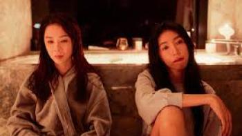 Born for the Spotlight TV show screenshot #3: Two young Asian women sit side by side, looking despondent.