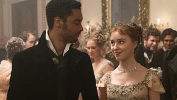 Bridgerton Season 1 TV show screenshot 1: Simon and Daphne are pictured at a social event, looking in each other's eyes and smiling