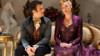 Bridgerton Season 3 TV show screenshot 3: Benedict and Lady Arnold have a discussion on a velvet sofa; both wear serious expressions on their faces