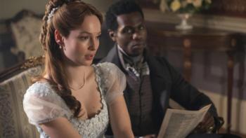 Bridgerton Season 4 TV show screenshot 2: Francesca and John sit together on a couch, staring discontentedly