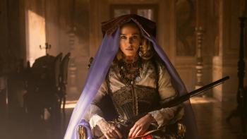 Brigands: the Quest for Gold TV show screenshot: A woman in old western dress and a purple veil holds a shotgun.