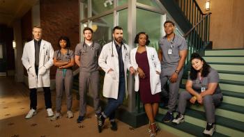 Brilliant Minds TV show screenshot: A group of male and female, white, black and Latino, doctors stands next to each other.