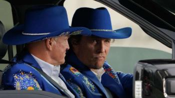 Brothers TV show screenshot 1: Dressed in bright blue Western suits with cowboy hats, Woody Harrelson is a passenger in a car with McConaughey driving