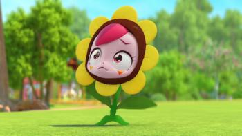 Catch! Teenieping: A small yellow flower with a human-like face is shown in a field.