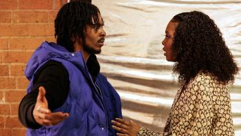 (L to R) Malcolm Kamulete wears a blue puffer vest and black hoodie, Déja J. Bowens Kamulete wears a blazer covered in stars.