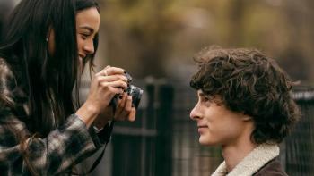 City on Fire TV show: a photographer takes a close-up of a friend