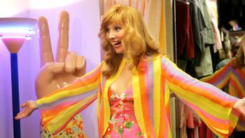 The Comeback TV show: Valerie in a bright outfit with her arms outstretched