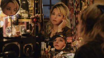 The Confidante: Christelle looks at herself in the mirror