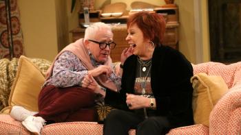 The Cool Kids TV Series: Vicki Lawrence and Leslie Jordan sit together on a couch, laughing. 