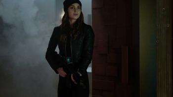The Copenhagen Test TV show screenshot 3: Michelle stands, armed, in a misty doorway