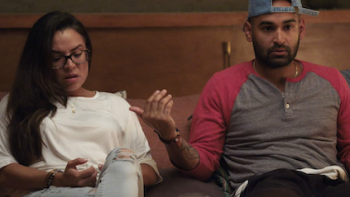 Couples Therapy screenshot 2: A woman and man on couch talking. 