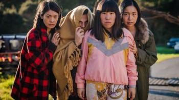 : Perlina Lau stands in front while JJ Fong, Jay Ryan, and Allu Xue hide behind her.