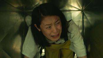 JJ Fong crawls through an air vent while sobbing.