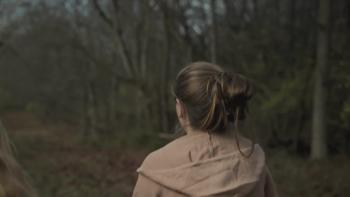 Crime Nation TV show screenshot: The back of a girl is shown walking through the woods.