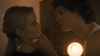 Cruel Intentions TV show screenshot 3: Caroline and Lucien are pictured in profile, Lucien leaning toward Caroline while holding her chin in his hand