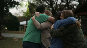 Daughters of the Cult TV Show Screenshot 3: Anna and Celia LeBaron hug their siblings Faye and Hyrum LeBaron in greeting.