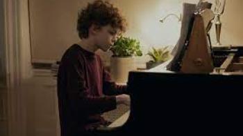 Dear Edward TV show: A White tween boy plays a piano