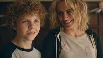 Dear Edward TV show: A White tween boy and a 30-something woman smile.