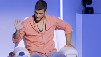 Deep Fake Love screenshot 2: Conestant in orange shirt pressing button on chair after deciding if video is real or fake. 