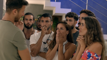 Deep Fake Love screenshot 3: A man talks to a group of cast members near stairwell.