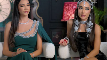 Desi Bling TV show screenshot 2: Alizey and Lailli Mirza in elegant dresses, sitting indoors, wearing jewelry.