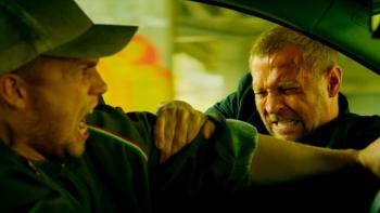 Detective Hole: Hole hangs on to the side of a speeding car