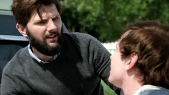 Do You Want to See a Dead Body? Series: Two men face each other; one is sitting on the ground and the other looks confused and upset. 