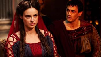 Domina: A white woman looks bored as a white man tries to talk to her.