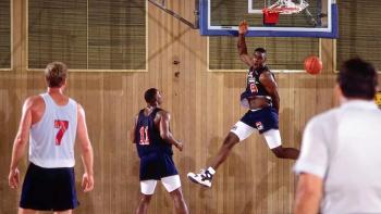 We Beat the Dream Team TV show screenshot 3: a college player dunks on Larry Bird