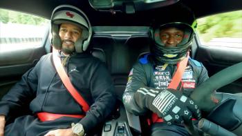 Drive with Swizz Beatz: Beatz (left) and a driver with helmets on inside a stock car