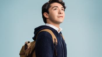 Dwight In Shining Armor: Up close shot of a preppy teenage boy with a backpack looking proudly into the distance