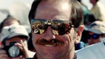 Earnhardt TV show screenshot 1: Dale Earnhardt, Sr. in sunglasses smiling. 