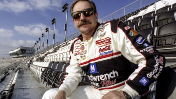 Earnhardt TV show screenshot 2: Dale Earnhardt, Sr. sits in bleachers wearing racing uniform