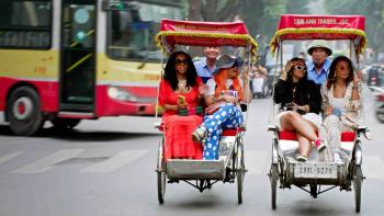 Eat Slay Love TV show screenshot: Two Black women sit next to another two Black women in Tuk Tuks in Thailand.