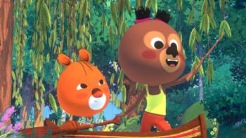 Edmond and Lucy: Two young bears stand in a canoe in a river in the forest. 