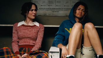 Euphoria Season 3: Lexi and Rue sit together at home; Rue has her knees drawn up and Lexi appears to be disgusted